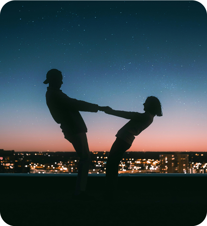Silhouette of people against sunset