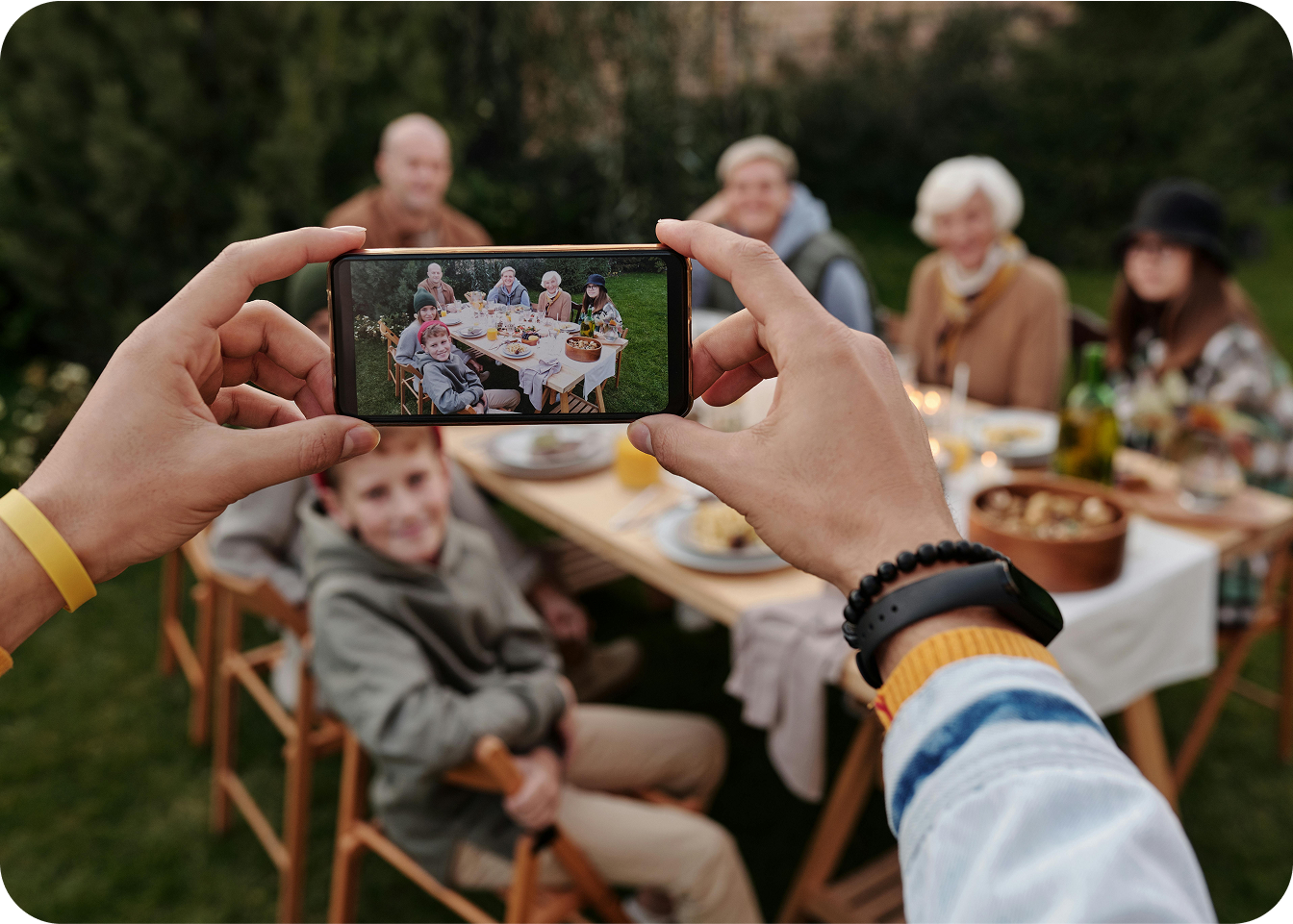 Family poses for a photo at a picnic